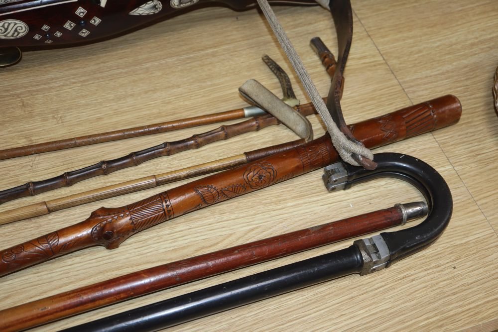 A European bone inlaid crossbow, two walking canes and three riding crops